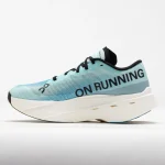 On Cloudboom Volt teal and cream racing shoe side view