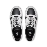 On THE ROGER Clubhouse black and white sneaker side view