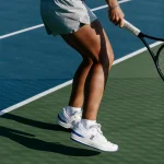 On THE ROGER Pro white and blue tennis shoe side view