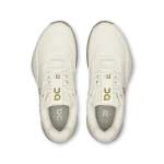 On THE ROGER Pro Ace ivory sneaker with gold logo side view